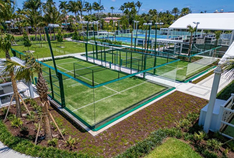Two glass padel courts with green frames at The Breakers in Palm Beach, Florida