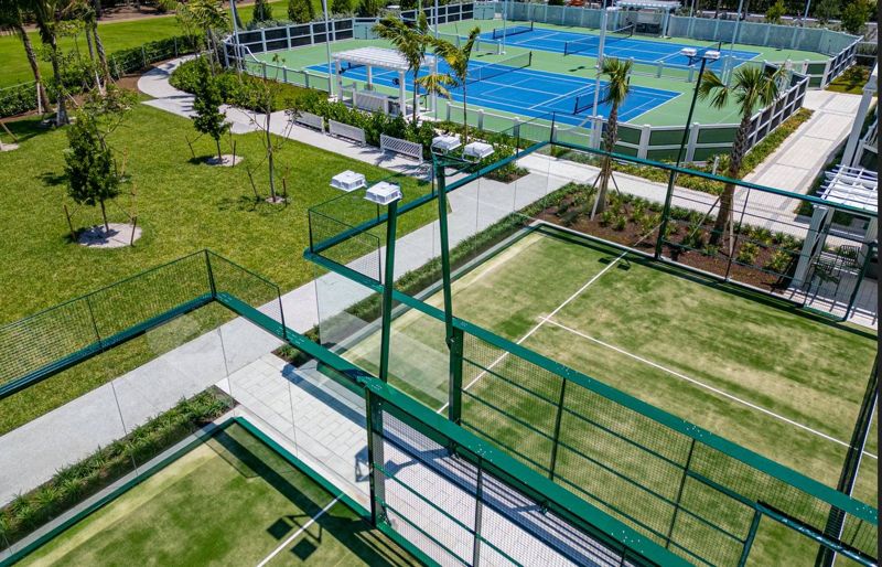 Aerial view of the glass padel courts beside the tennis courts at The Breakers, Palm Beach