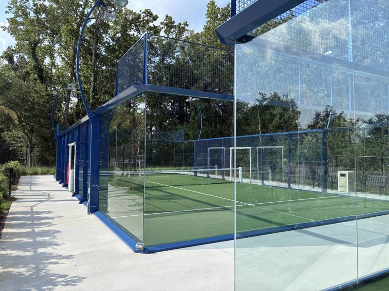 Blue-framed glass padel court on Daniel Island in Charleston, South Carolina
