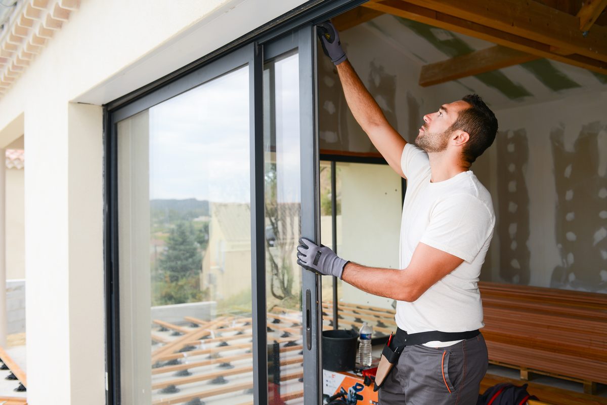 Installer fitting a window